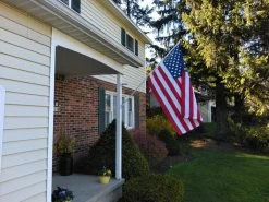 Aluminum Spinning Pole -Flags and Banners Store battle tough american flag and spinning pole on house