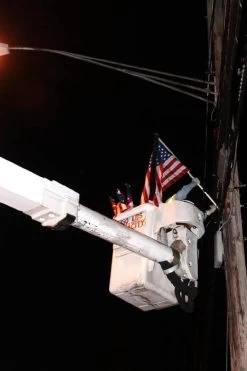 Flags and Banners Store -Flags and Banners Store installing flag on street pole please remember me